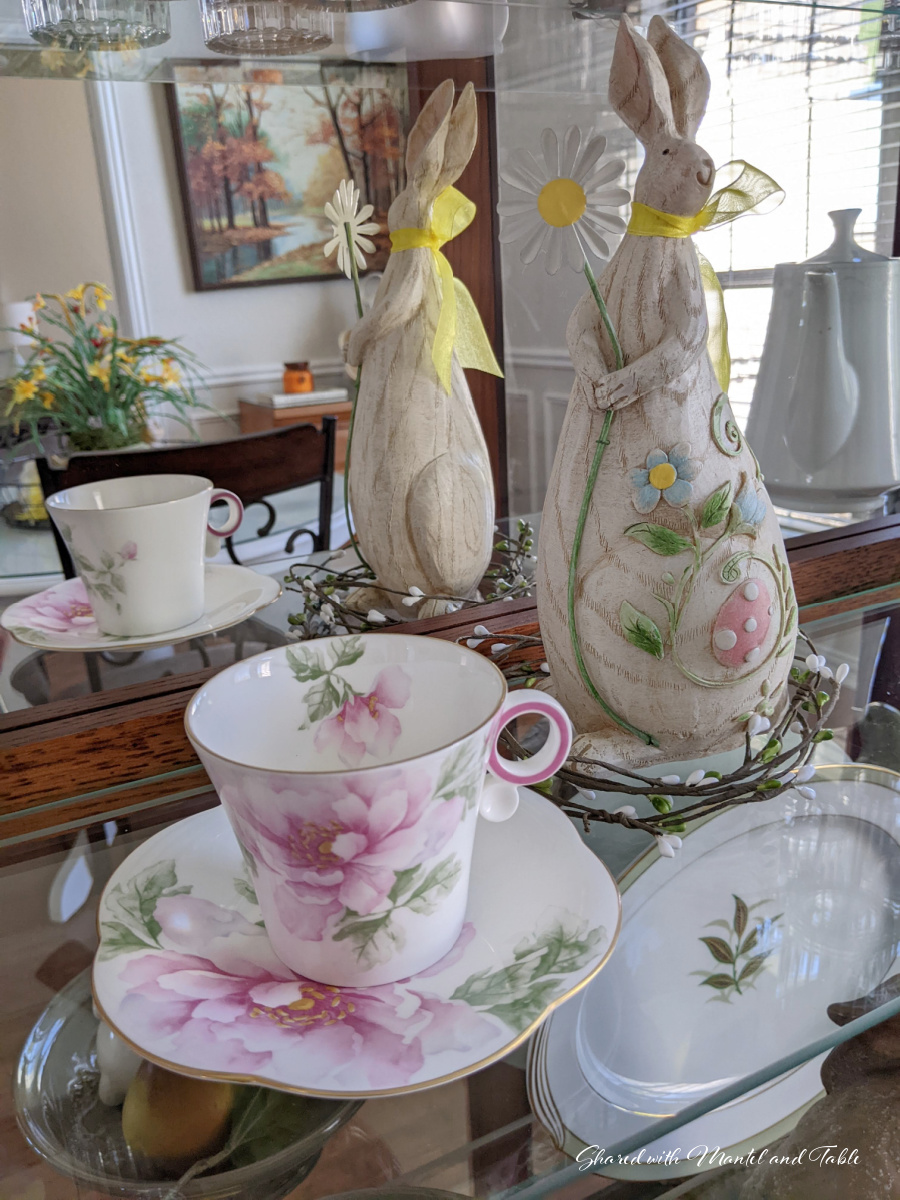 Tea and friendship - teacup with wooden bunny in cabinet