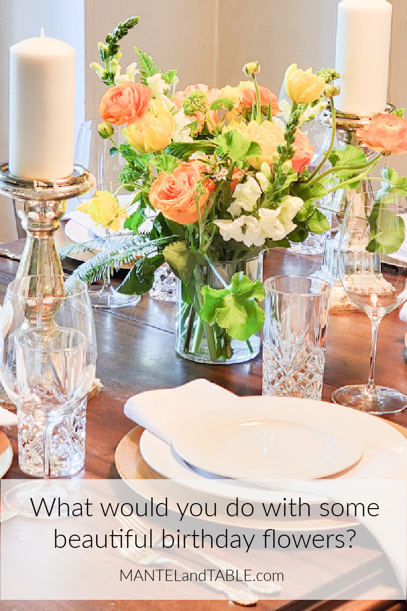 Beautiful birthday flowers centerpiece on a formally set table. Pinterest banner