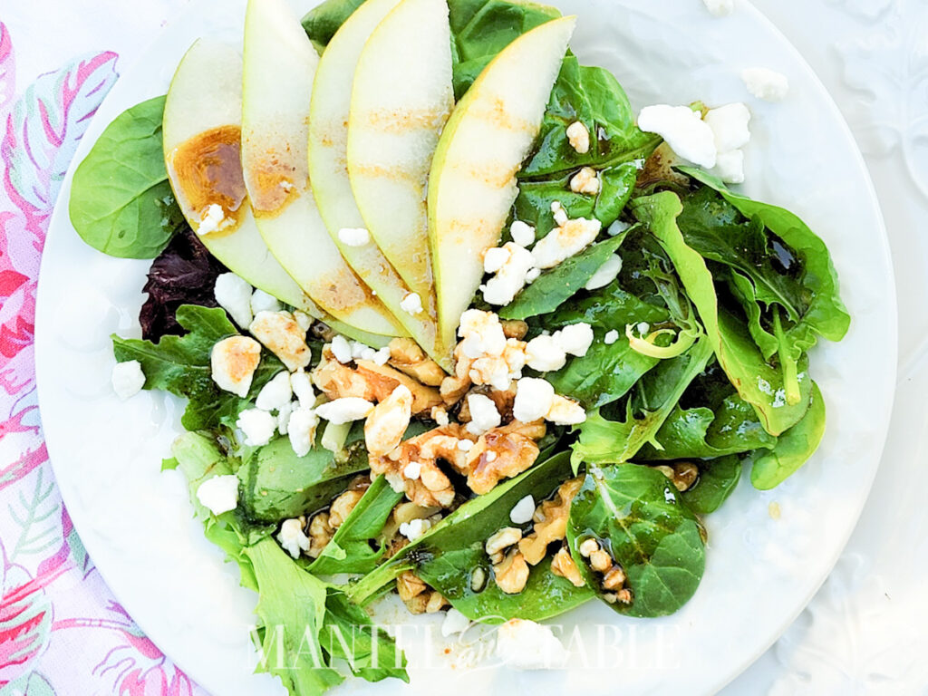 Closeup of green salad on white plate