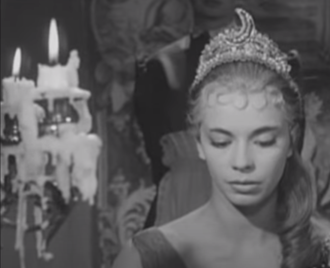 black and white photo of scene from the movie Smiles of a Summer Night showing candelabra covered in dripping wax