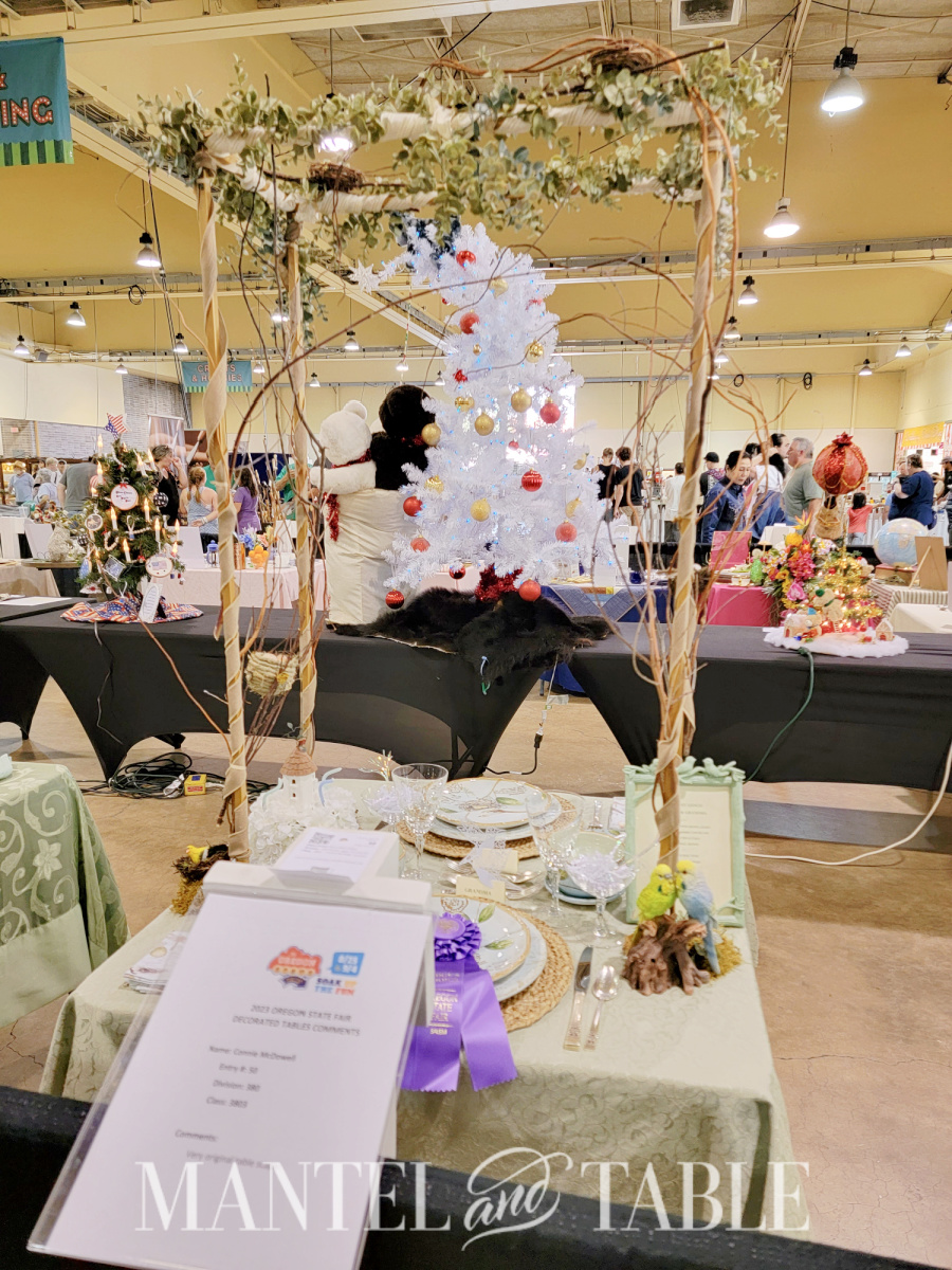 2023 tablescape competition table with bird theme and trellis