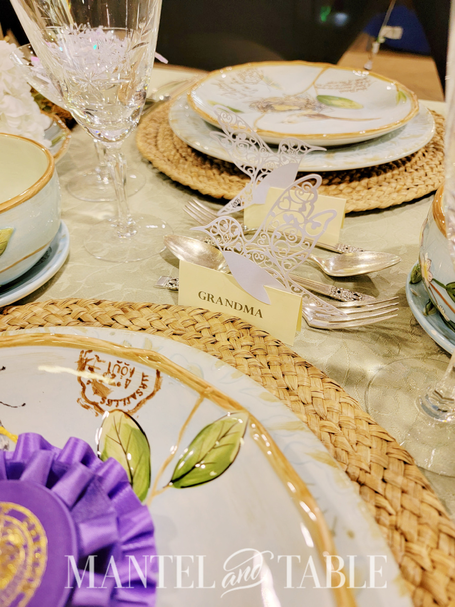 Closeup of place card holders and dessert flatware on a table
