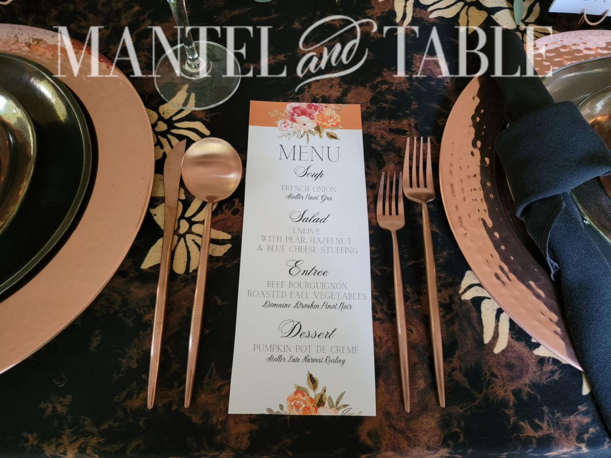 Orange flower design Menu between two place settings on Copper fall tablescape