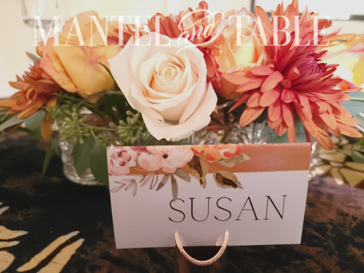 Orange flower design place card closeup