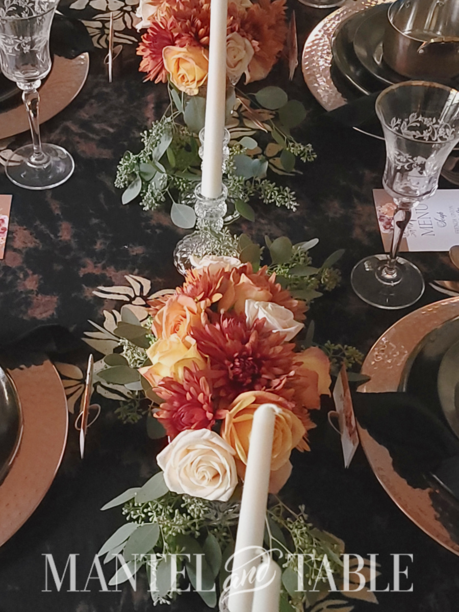 Orange, yellow, cream flower centerpiece closeup