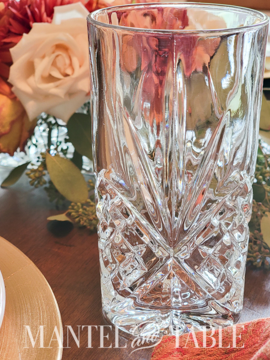 Closeup of cut crystal water glass in a formal table setting