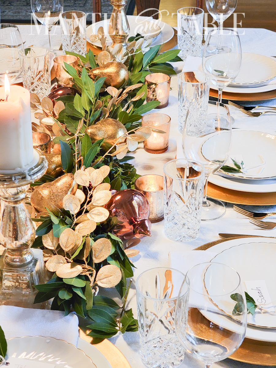 Tablescape with bay leaf and gold centerpiece garland