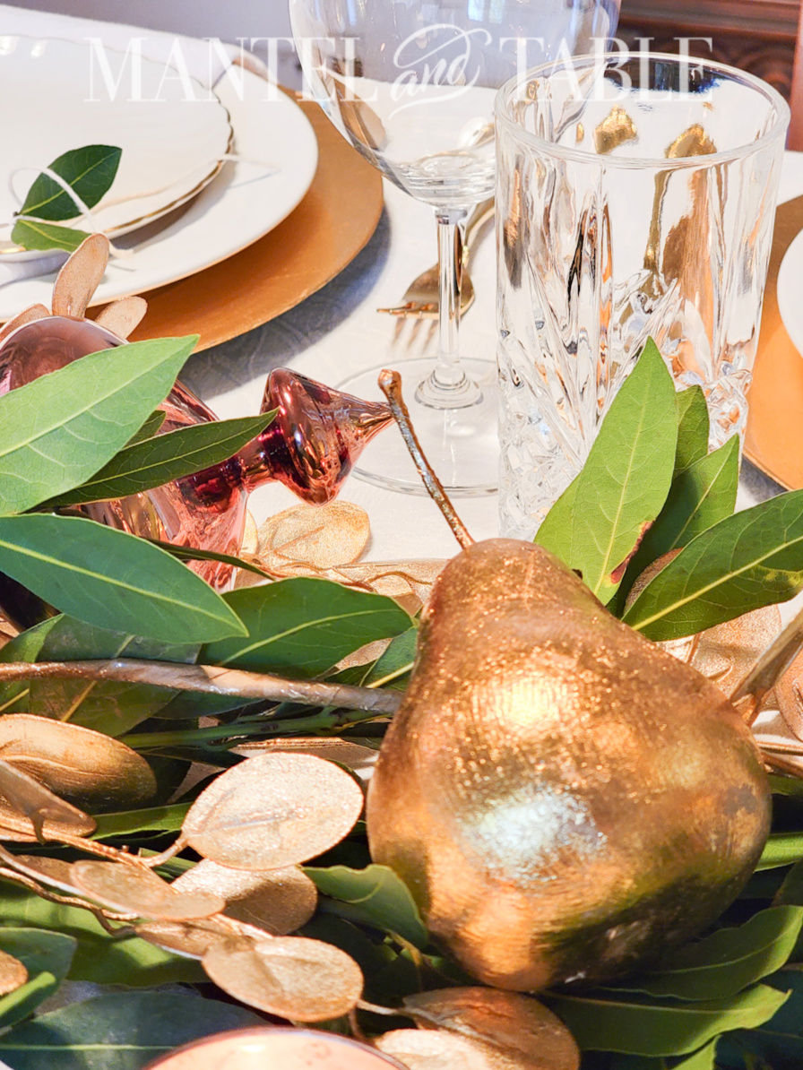 Gold leafe-covered pear in centerpiece