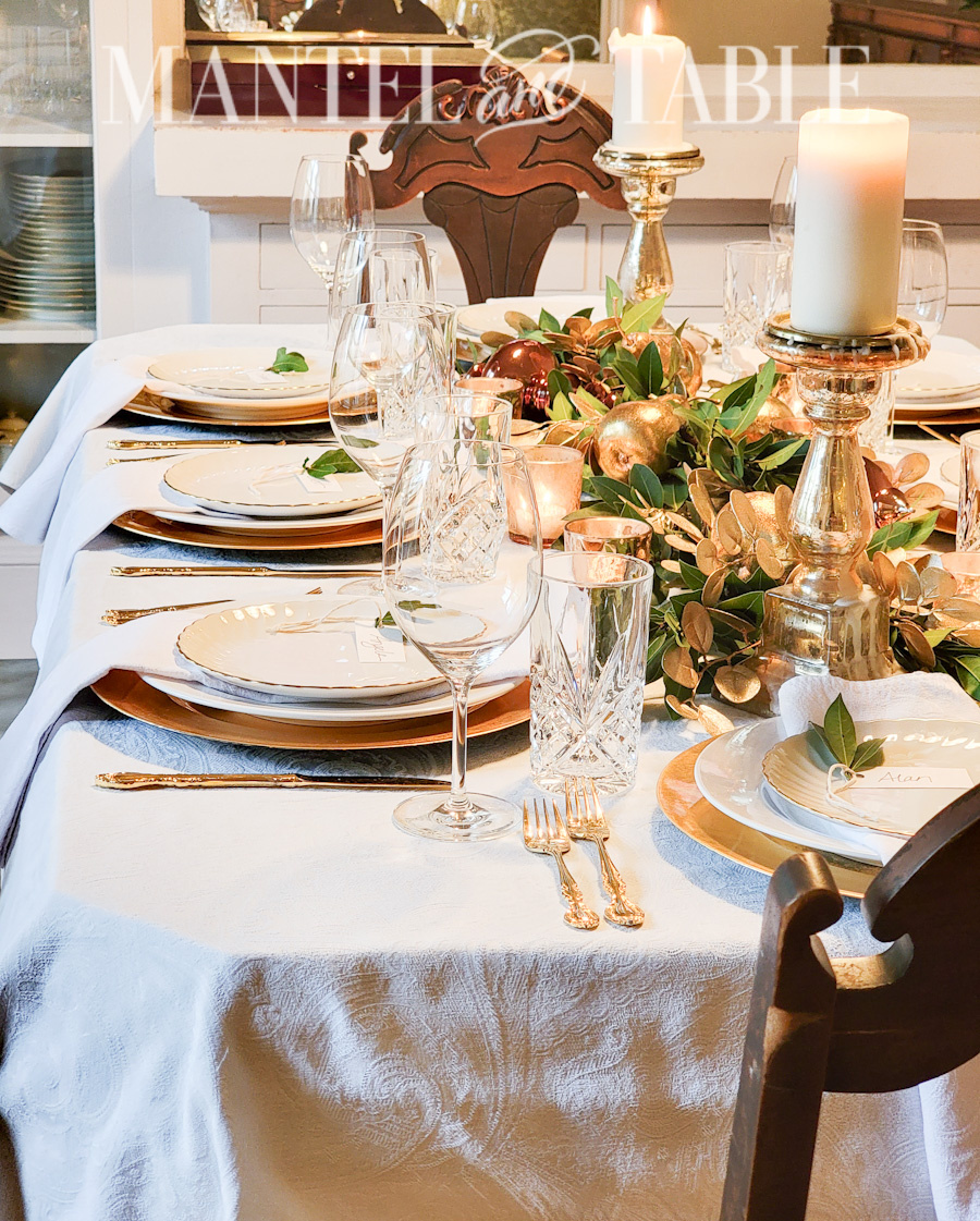 Gold and white table setting side vie