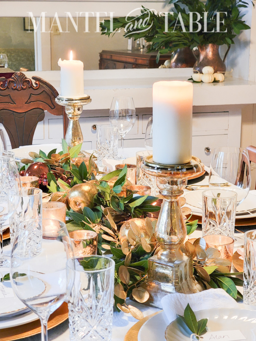 Gold and white table setting in din ing room