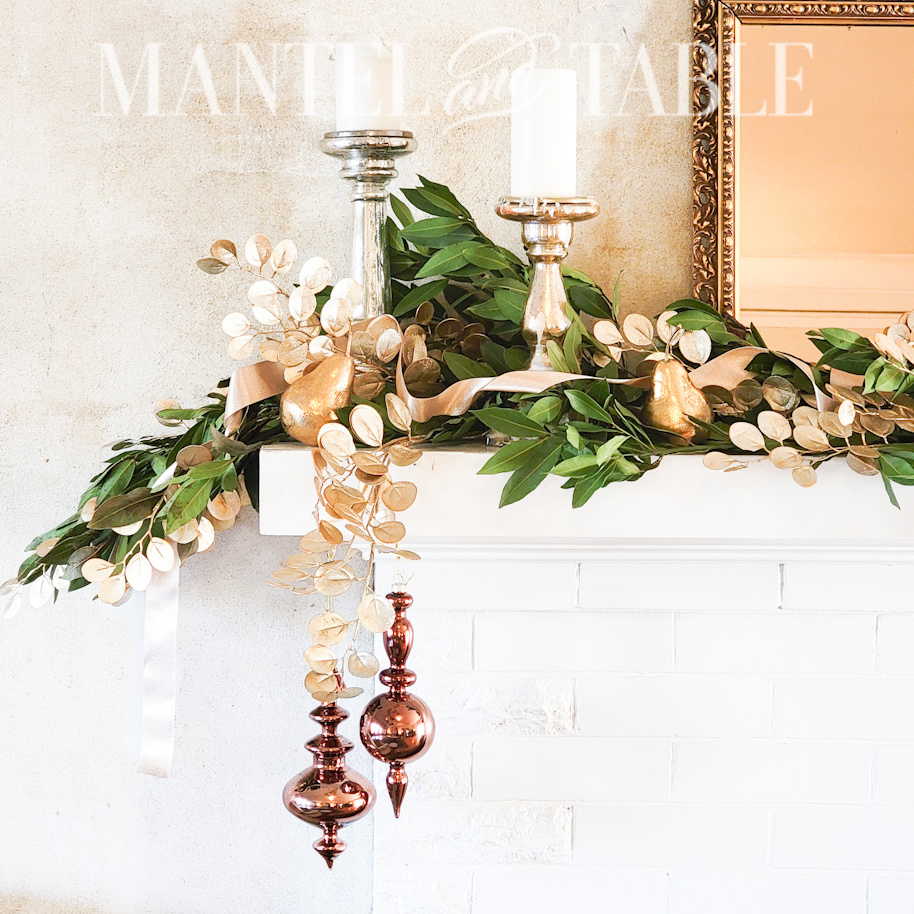 gold mantel decor with ribbon