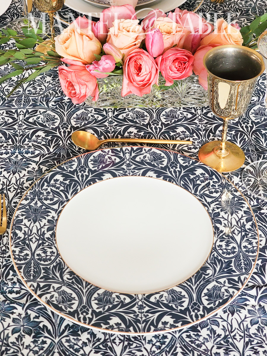 Blue patterned charger plate at Blue tablescape place setting