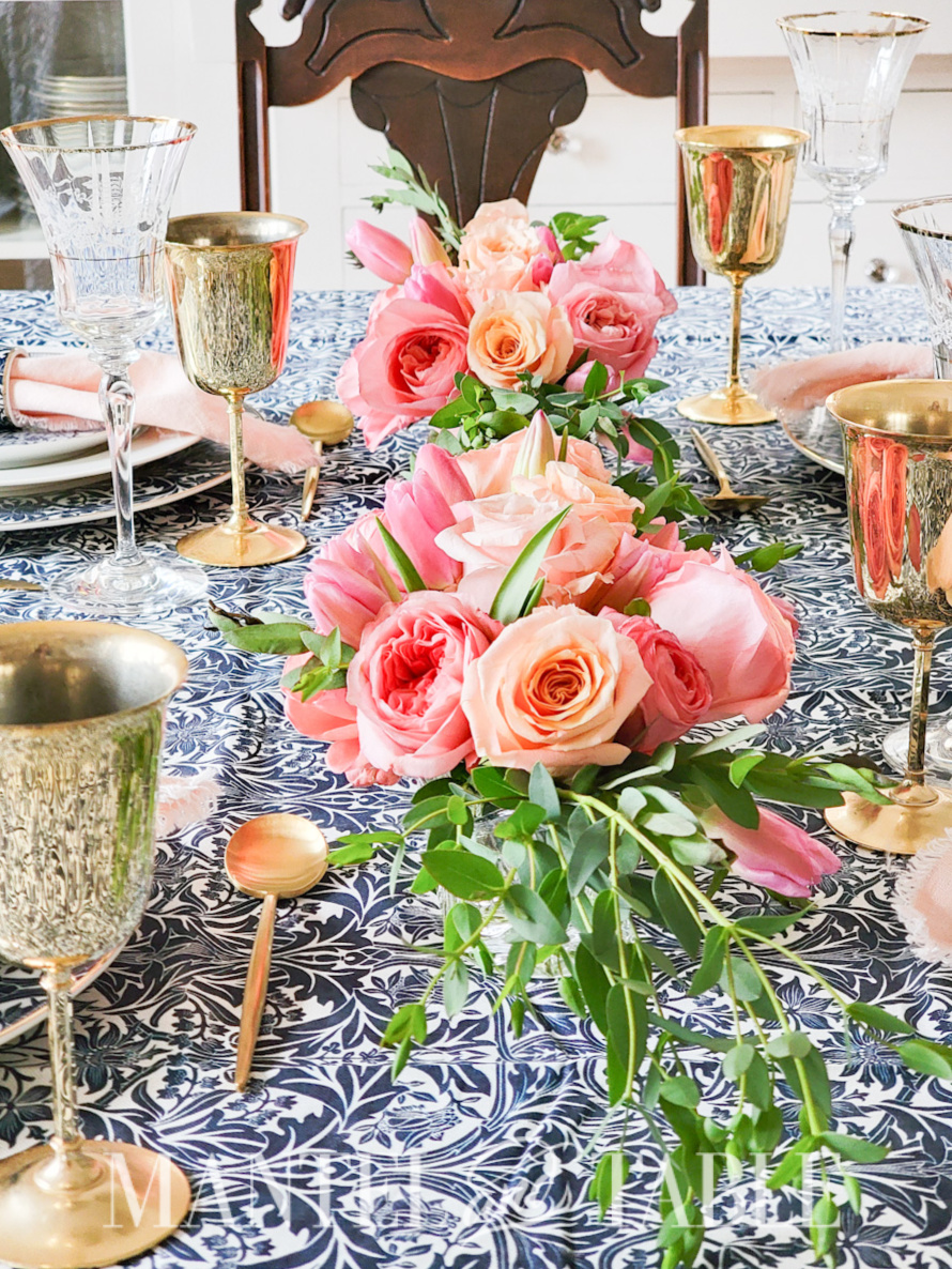 Annual Survey - blue and gold tablescape with pink rose centerpieces