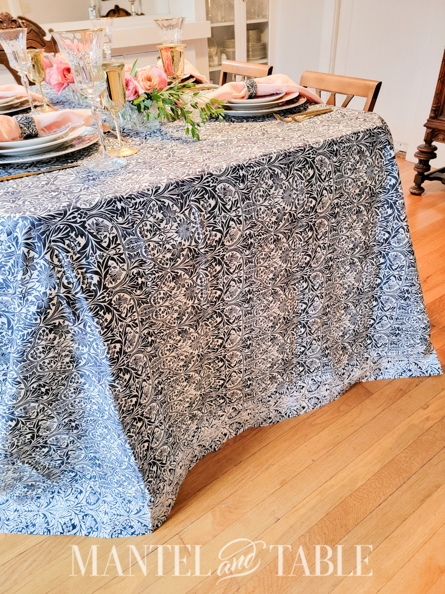 Formal table from the side showing floor length patterned tablecloth