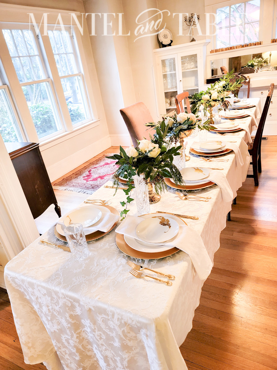 glamorous table setting at two long white-tablecloth covered tables