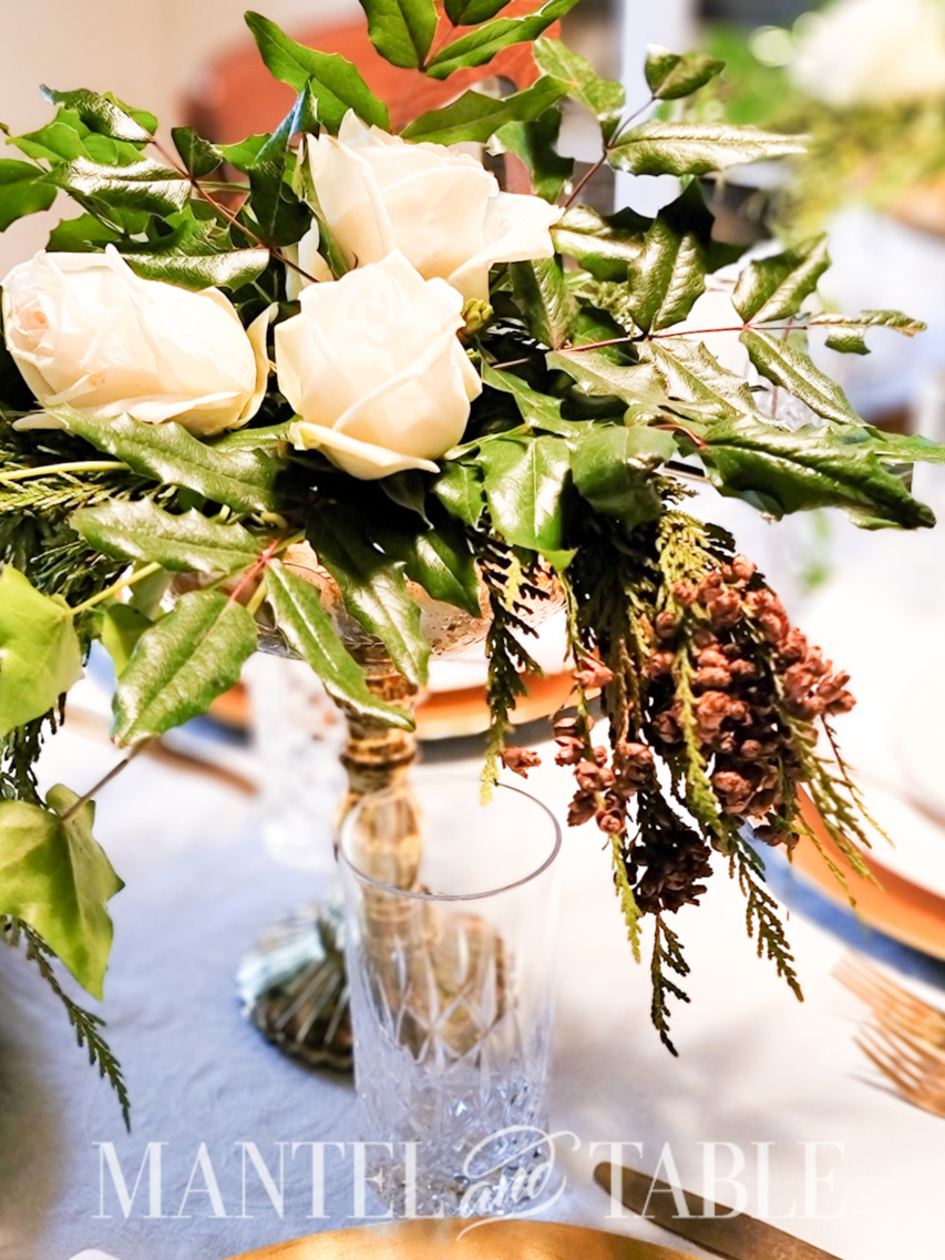 Rose and evergreen centerpiece closeup