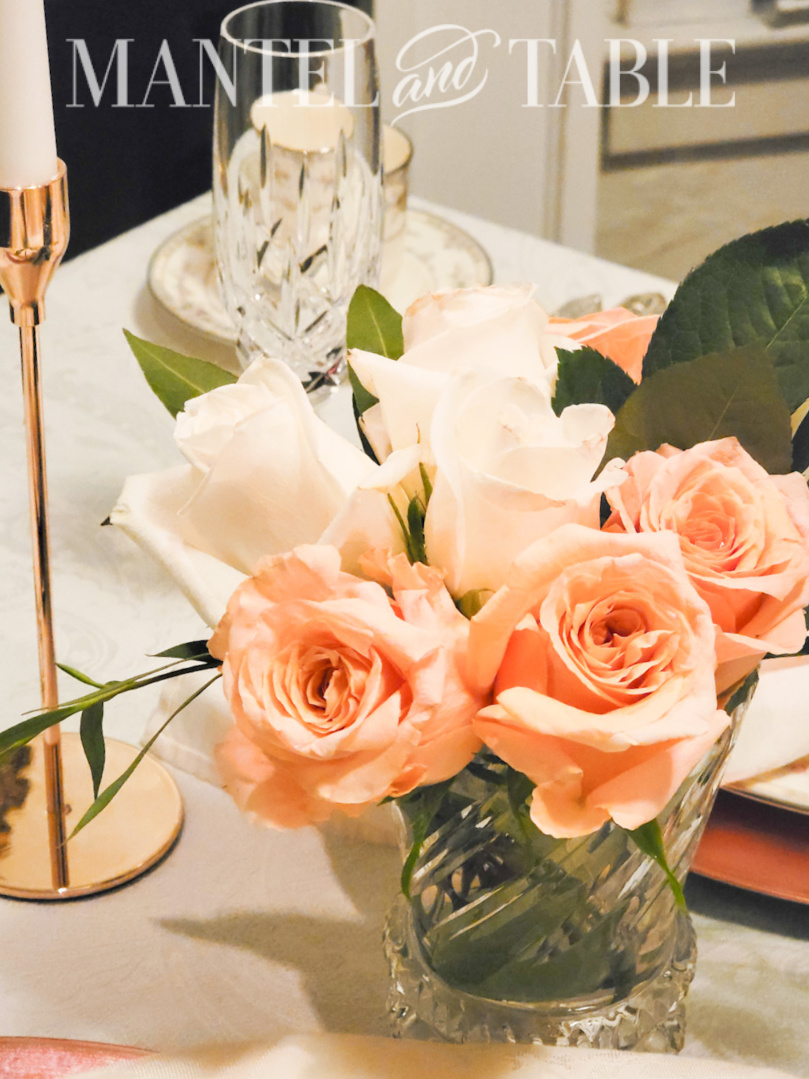 Top view of peach and white rose flower arrangement