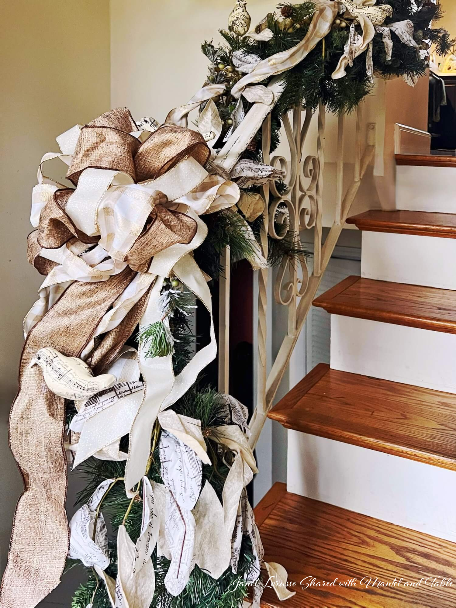 Gold and white stair railing ribbon decorations