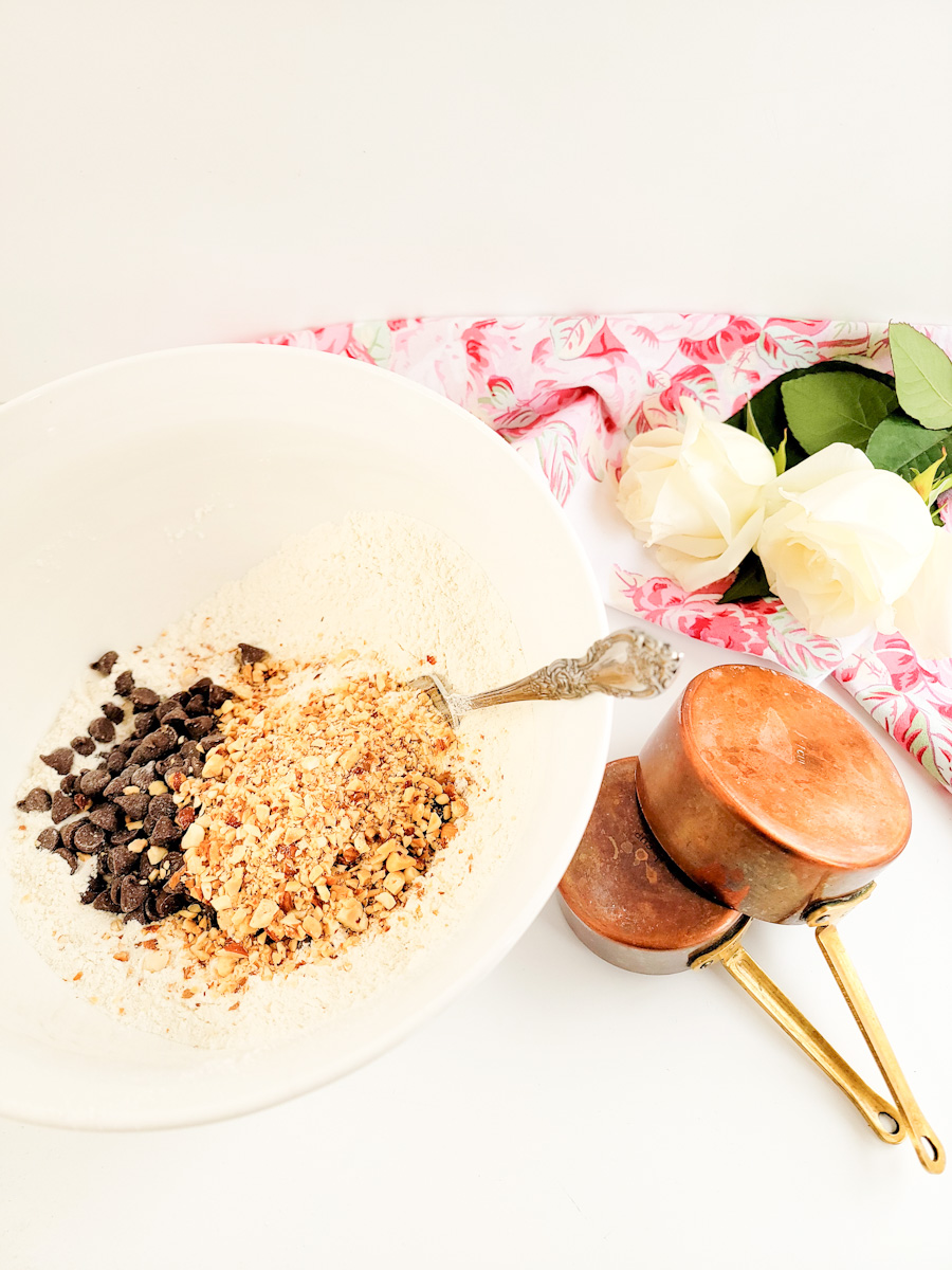 cream scone ingredients including chocolate chips and nuts in a bowl