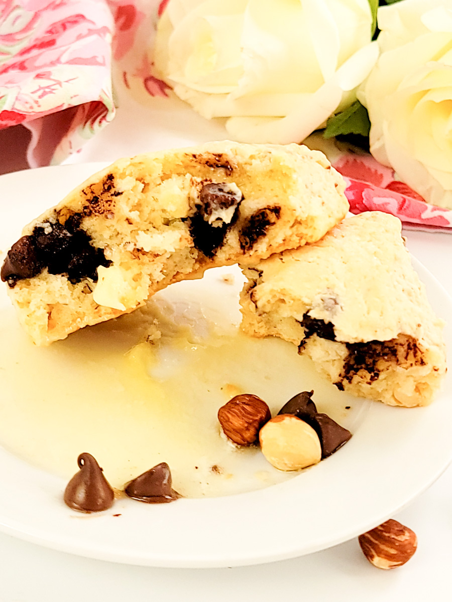 Single scone broken in half on a plate