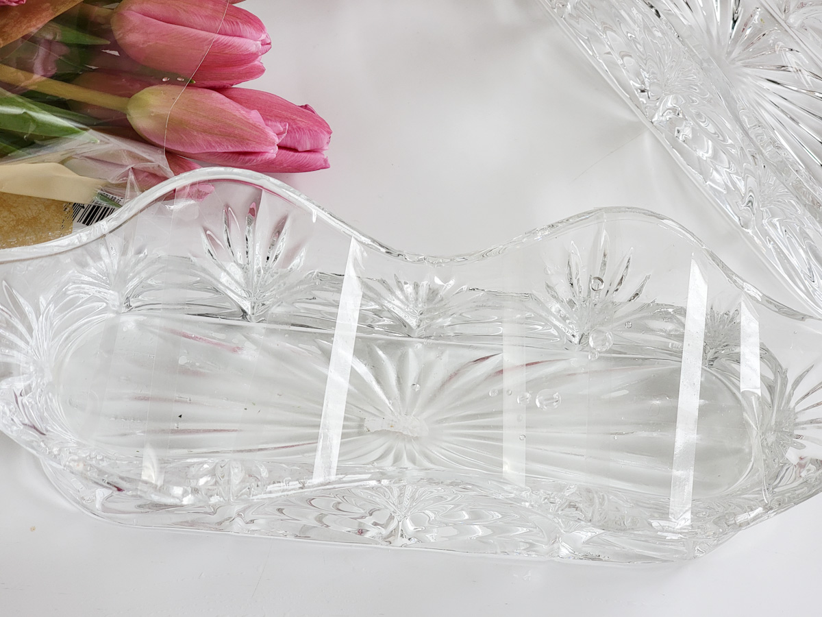 Closeup of clear tape grid on long crystal vase