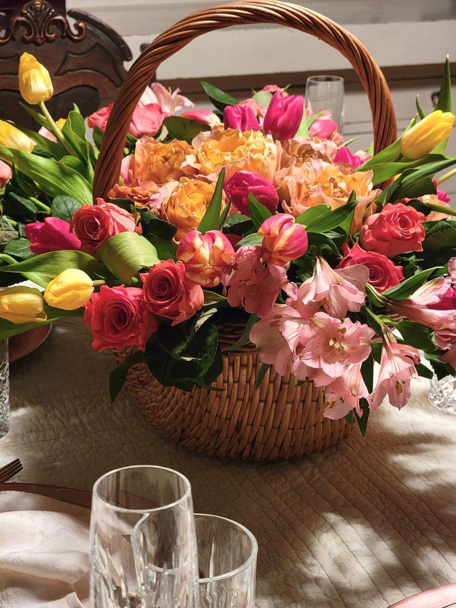 Spring garden tablescape with basket of flowers