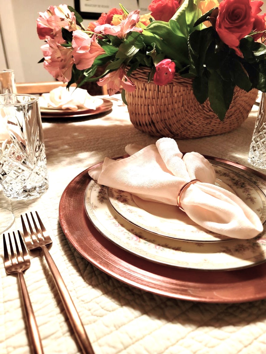Spring garden tablescape place setting with copper flatware