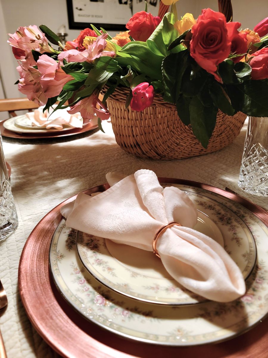 Closeup of plates in a formal tablescape