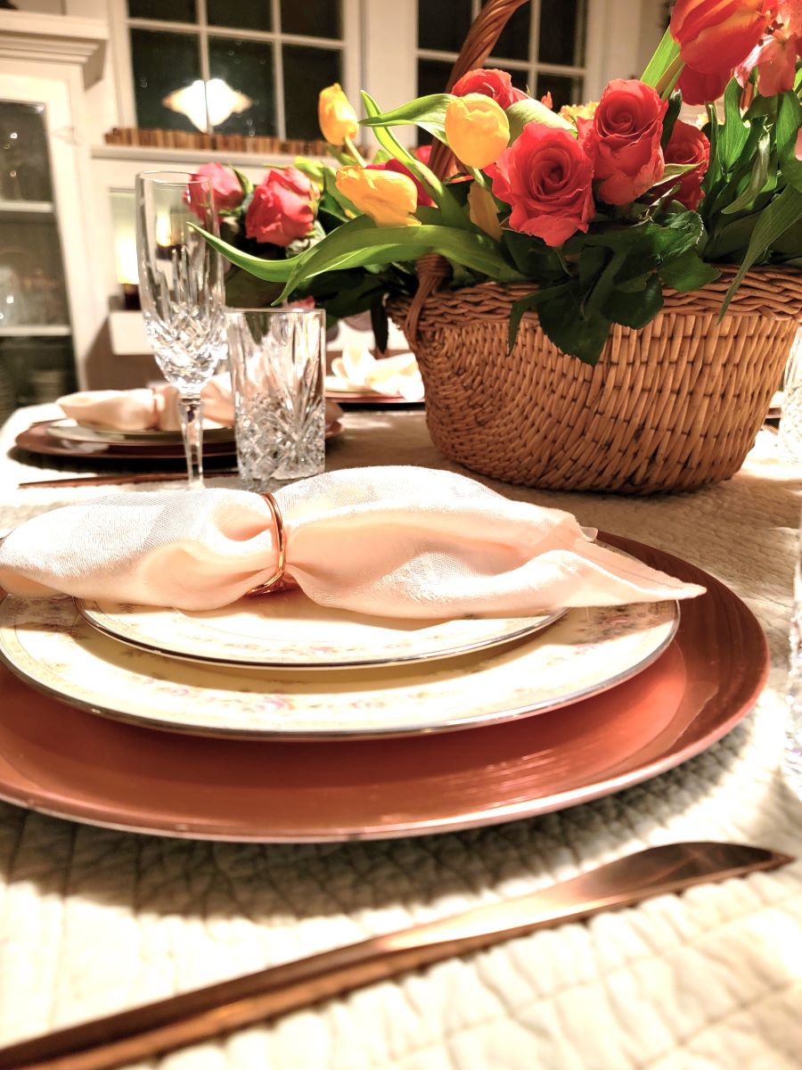 Closeup of pink napkin on plate