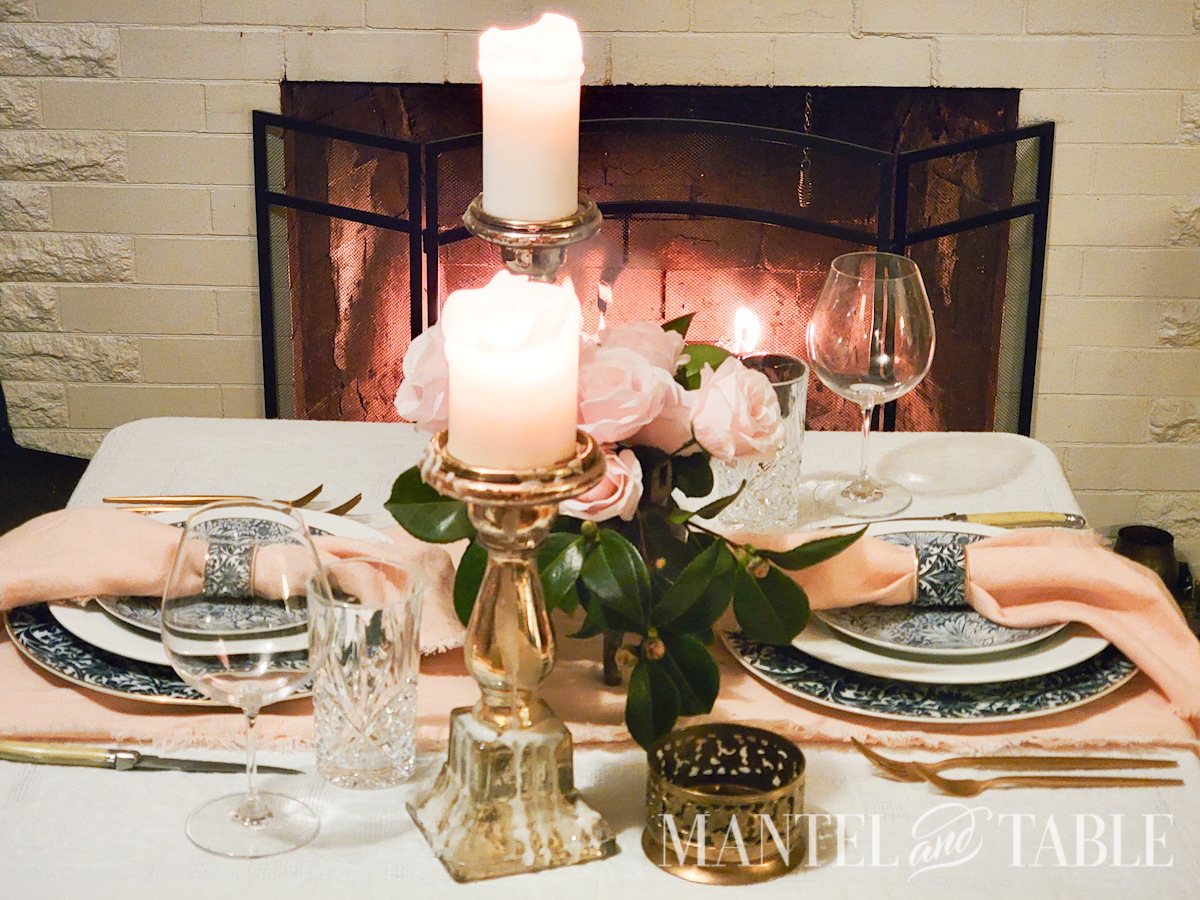 Dinner table Peach and Blue Table Setting by fireplace