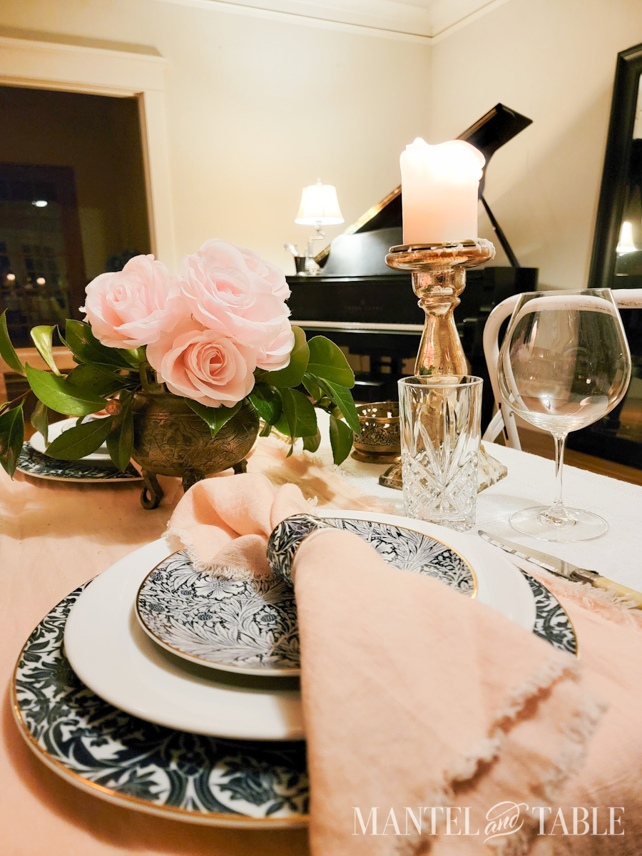 Dinner table set for two in the living room