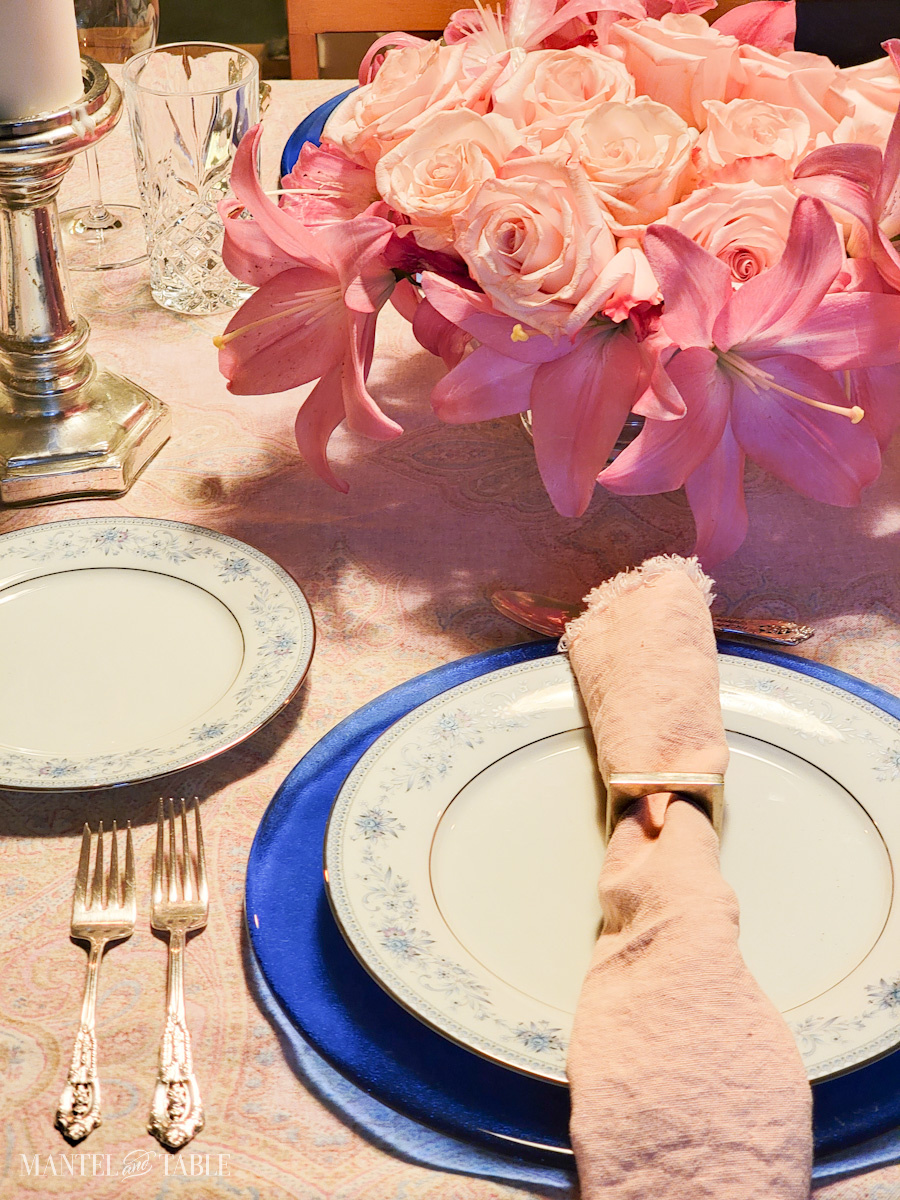A place setting on a pink and blue tablescape