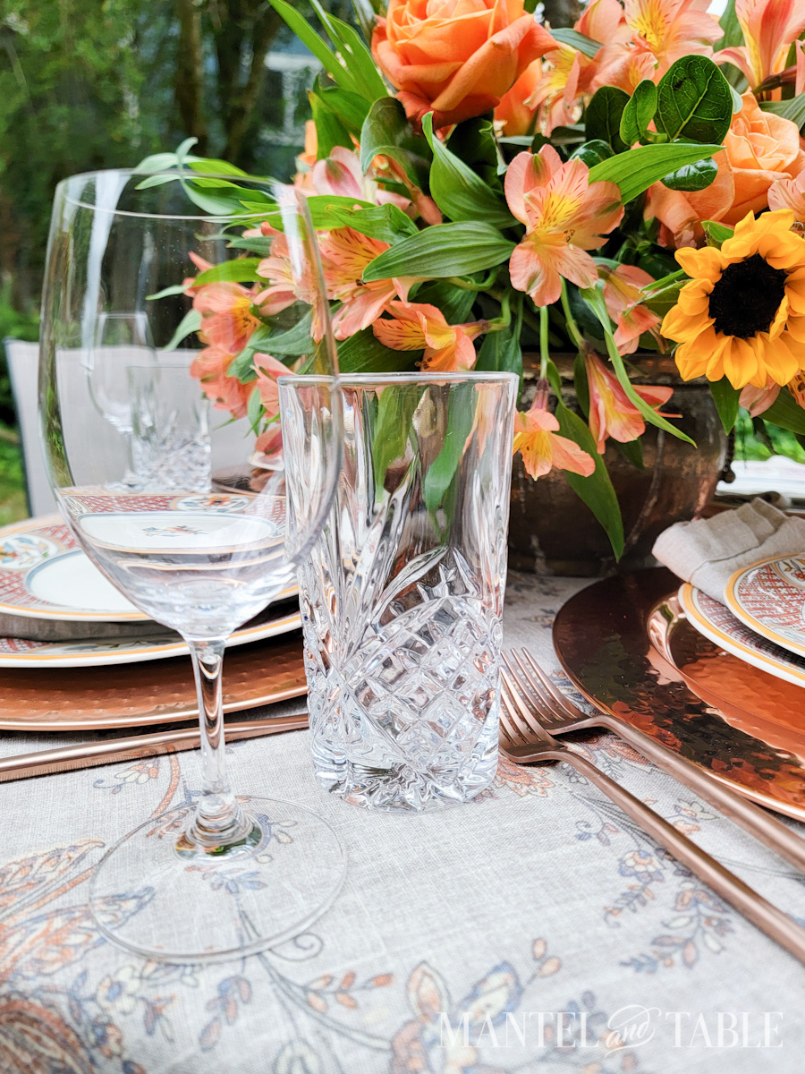 Wine and water glass on a table set for dinner