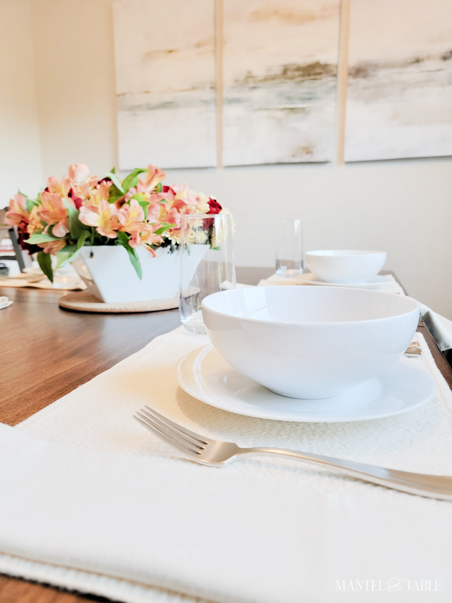 brunch table setting with cream colored placemat and napkin