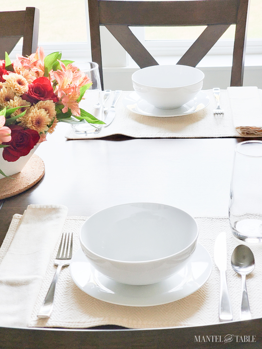two placesettings at a breakfast table