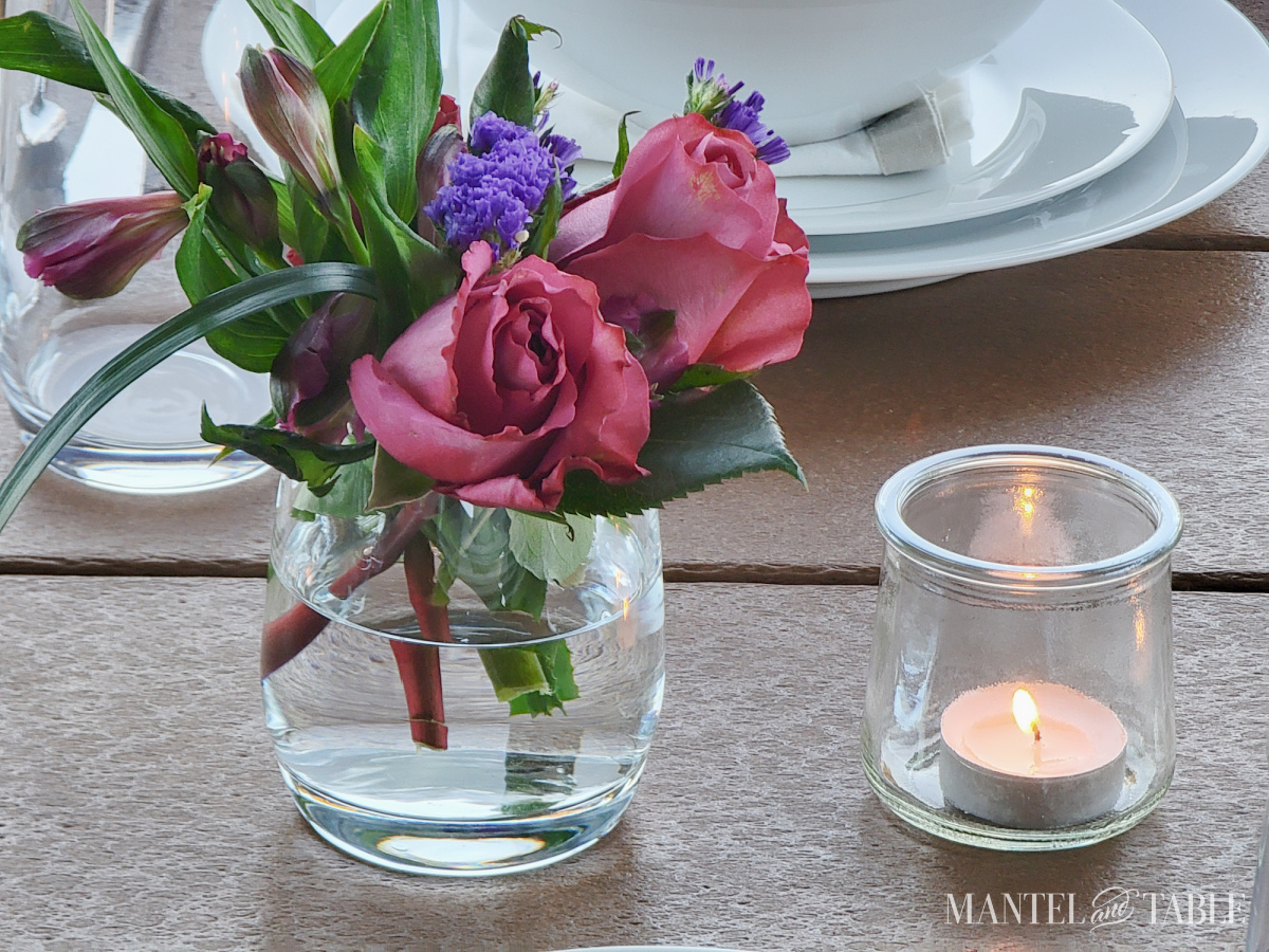 Closeup of flowers and candle on a Sunset tablescape